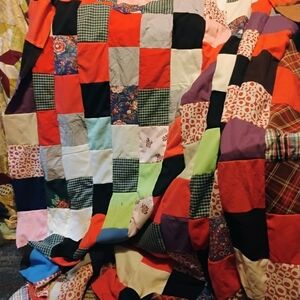 Colorful Patchwork Quilt with Red, Black, and Purple